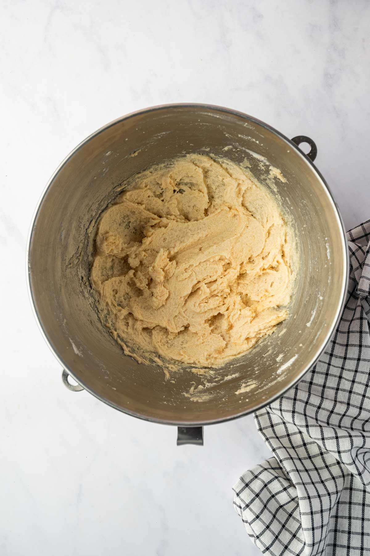 The butter is creamed with the sugar in a stand mixer.